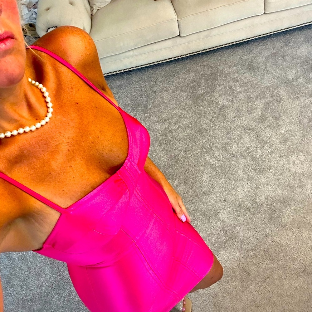 Shiny hot pink dress. Can fit a small/medium .. work once excellent condition
